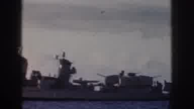 Oahu Hawaii USA (1959): A Battleship Cruising Through The Water In The Middle Of