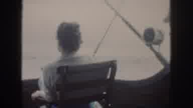 Oahu Hawaii USA (1959): Woman Sitting On Fishing Boat Looking Out At Sea While