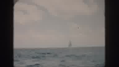 Oahu Hawaii USA (1959): A Recreational Speed Sailboat At Sea With People Aboard In