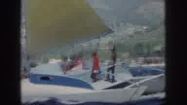 Oahu Hawaii USA (1959): White Sail Boat Near Shore With Four People Moving In