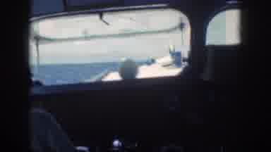 Oahu Hawaii USA (1959): Captain Operating A Water Vessel At Sea During Clear Skies