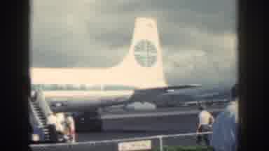 Oahu Hawaii USA (1959): People Boarding Plane On A Cloudy Day