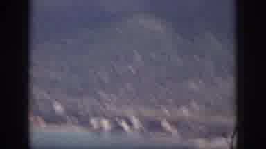 Oahu Hawaii USA (1959): Mountains Full Of Trees With A City Near The Sea