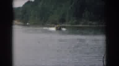 Grand Rapids Michigan USA (1961): A Small Moving Boat In The Lake Is Pulling A