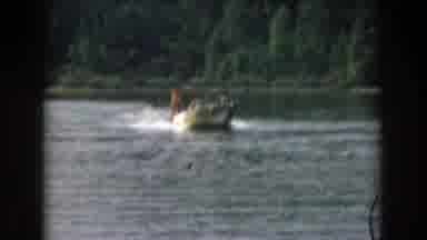 Grand Rapids Michigan USA (1961): Water Skiing Behind A Small Boat On A Lake In