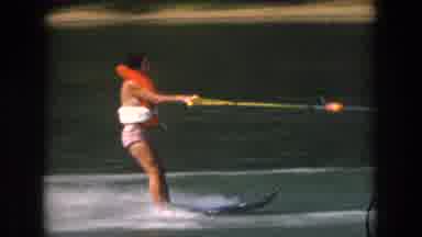 Grand Rapids Michigan USA (1961): Woman Water Skiing Behind A Motor Boat At A Lake