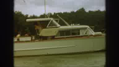 Michigan USA (1961): White Power Boat In The Water With Clouds In Sky Cruises