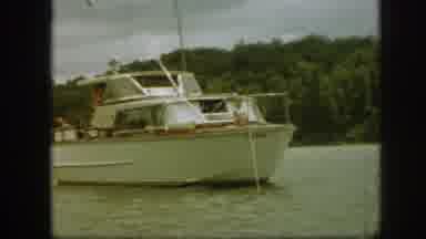 Michigan USA (1961): A Small Yacht Anchored Off The Shore In A Tropical Inlet