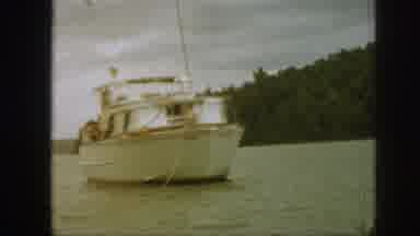 Michigan USA (1961): Man On The Bow Of A Boat, Throwing What Appears To Be An