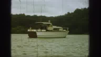 Michigan USA (1961): Two Different Boats Floating By On The Lake Surrounded By