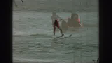 Michigan USA (1961): Man In Orange Life Vest Water Skiing Being Pulled By A Boat