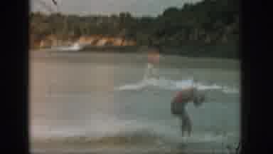 Michigan USA (1961): A Man Surfing In A Beautiful River With His Friends