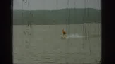 Michigan USA (1961): Person Water-Skis On A Large Lake Near The Shoreline