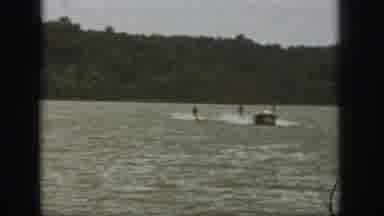 Michigan USA (1961): Two People Water Skiing On A Lake And One Falls Down