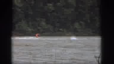 Michigan USA (1961): Person Skiing Fast Behind A Boat Wipes Out Big Time Amid A