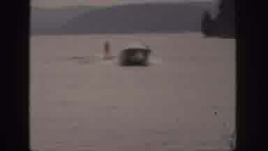 Michigan USA (1961): Boat Pulling A Person On A Water Ski On The Lake With