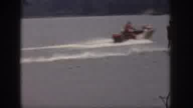 Michigan USA (1961): People Water Skiing And Riding In A Boat