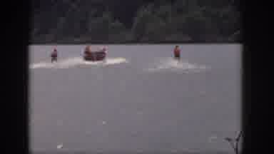 Michigan USA (1961): A Group Of Water Skiers Tear Up A Lake As A Unit