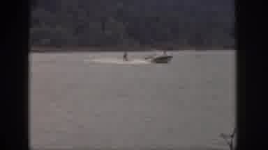 Michigan USA (1961): Man Rides On Water Skis On The Back Of A Speedboat