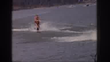 Michigan USA (1961): Man Skiing Behind A Boat Goes Down And Waves Off The Camera