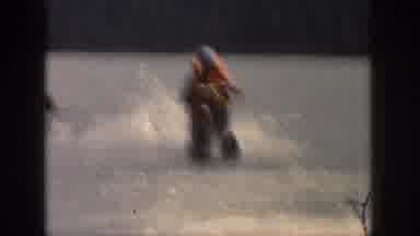 MICHIGAN USA-1961: Man Water Skiing on Lake in Vintage 8mm Home Movie