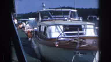 Michigan USA (1961): A Small Boat Sits Anchored At The Dock Of A Lake