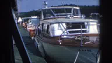 Michigan USA (1961): House Boat At Dock Topless Smoking Man Running The Motor