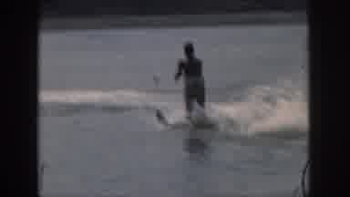Michigan USA (1961): A Man Being Pulled In The Water While He Rides Water Skis