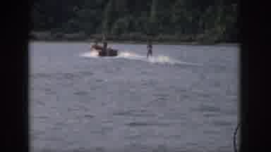 Michigan USA (1961): A Person Jet-Skiing On An Open Lake On A Sunny Day