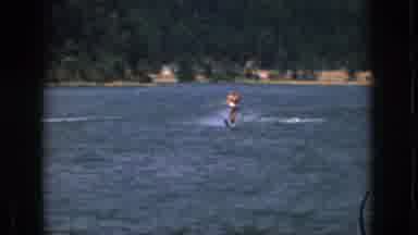 Michigan USA (1961): Man In Swim Shorts Slalom Water Skiing On Lake In A Dry