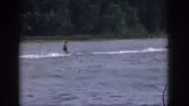 Michigan USA (1961): A Person Does Some Water Skiing On A Lake During A Sunny Day