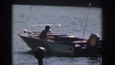 Michigan USA (1961): Single Man Steering A Motor Boat On A Blue Waters