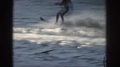 Michigan USA (1961): A Man Wakesurfing In The Water Behind A Boat Having Fun