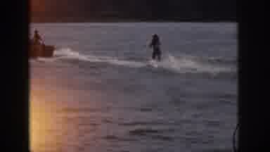Michigan USA (1961): Sportsman Surfing Behind A Boat By The Sea