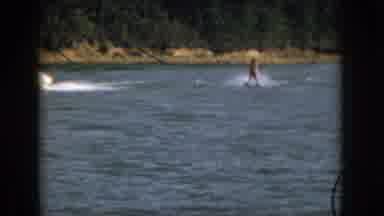 Michigan USA (1961): Someone In A Life Jacket Gliding Across The Water Behind A