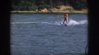 Michigan USA (1961): Woman Water Skiing On A Lake With An Orange Life Vest In The