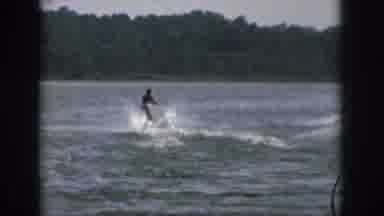 Michigan USA (1961): A Water Skier Creates A Wake As They Move Through The Water