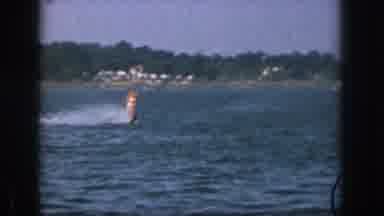 Michigan USA (1961): A Man Water Skiing On A Single Ski On A Large Lake Or River