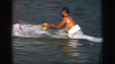 Michigan USA (1961): Man Falling Trying To Get Up On Skis Being Pulled By Boat