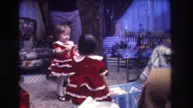 Medford New Jersey USA (1973): A Cute Child Dressed In A Santa Outfit Plays With A