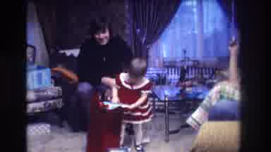 Medford New Jersey USA (1973): Small Girl Tries To Unwrap Present In Living Room