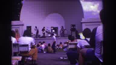 Medford New Jersey USA (1973): Man Then Child Walk Through An Outdoor Concert