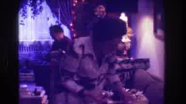 Medford New Jersey USA-1973: Children Opening Christmas Gifts in Vintage Home Movie