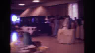 Boston USA (1974): Many People Are Sitting And Standing Around A Banquet Hall
