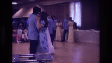 Boston USA (1974): A Few Couples Dancing In A Hall While Others Watch From The