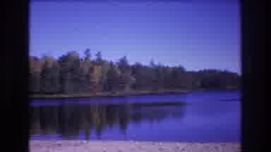 Baxter Maine USA (1975): Film From The Edge Of A Beach Panning Across A Large Lake