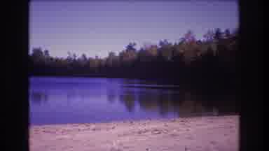 Baxter Maine USA (1975): A Lone Boy Fishing On The Shore Of A Lake