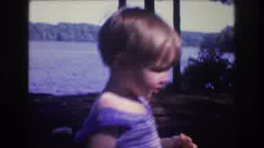 Baxter Maine USA (1975): Child On Picnic With Family On A Riverbank