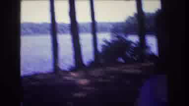 Baxter Maine USA (1975): A Kid Playing With A Binocular Near A River