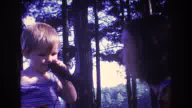 Baxter Maine USA (1975): Women Talking To Little Boy Who Is Playing With Toy In